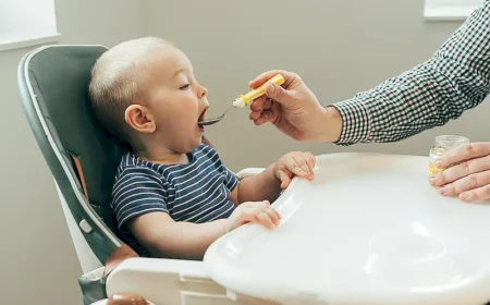 father-feeding-cute-baby-with-puree